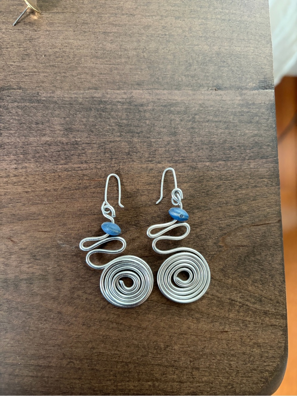 Handcrafted Silver Spiral Drop Earrings with Blue Accent